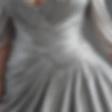 Close-up of the fabric detailing on a silver plus size dress