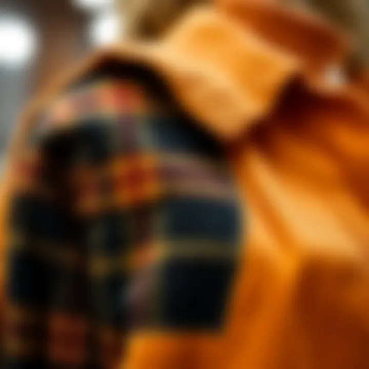 A close-up view showcasing the texture of a corduroy plaid panel drop shoulder jacket