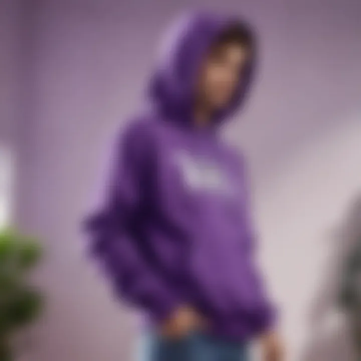 A casual outfit featuring a purple graphic hoodie paired with jeans and sneakers